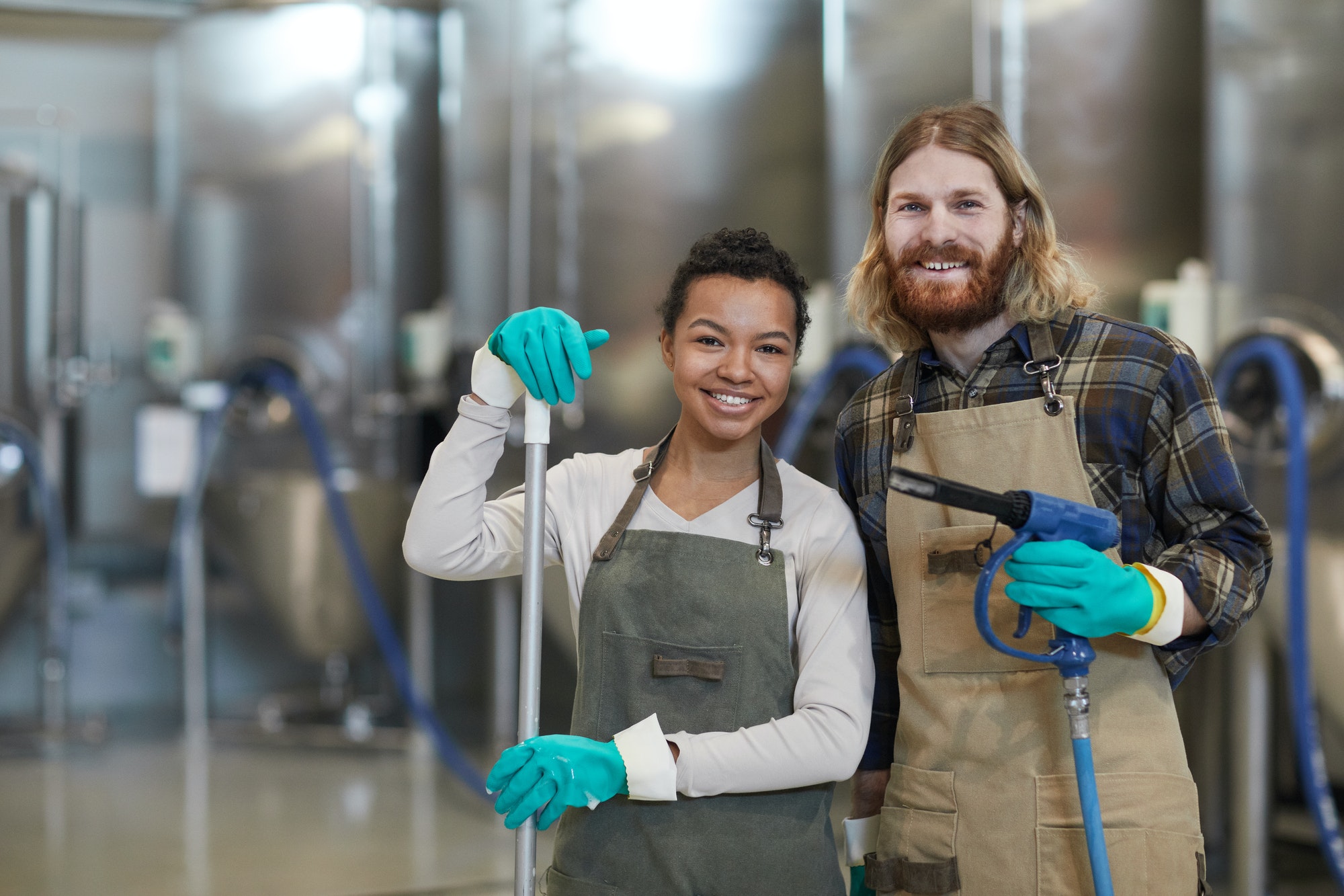 two-cleaning-workers-smiling-at-camera.jpg